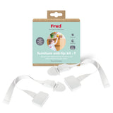 A Fred Safety Furniture Anti-Tip Kit (x1) - Pure White box is shown with two white anti-tip straps. This kit features a sturdy anchor to secure furniture and help protect children from tipping accidents.
