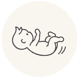 A minimalist black line drawing of a baby lying on its back inside a light cream circular badge.